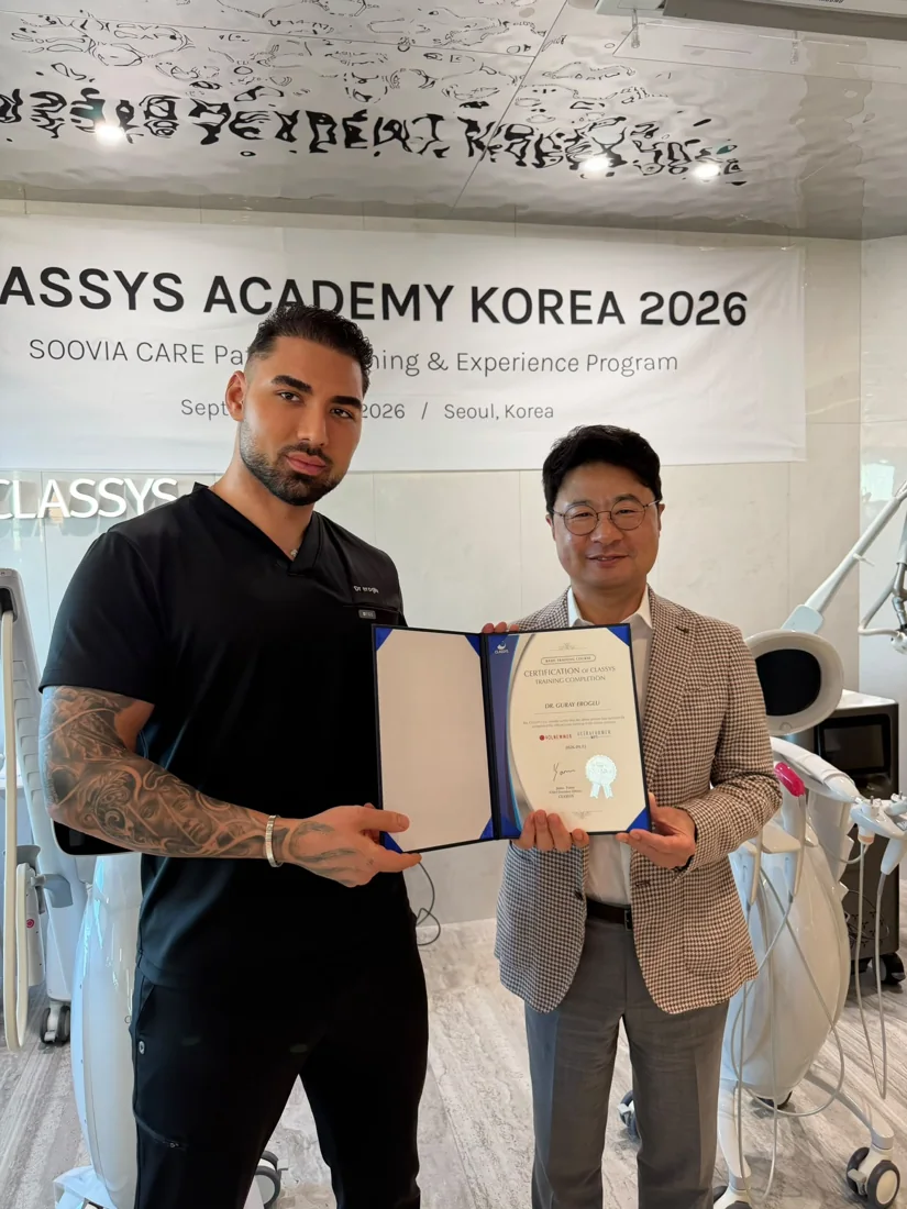 Dr Eroglu holding his CLASSYS training-completion certificate in Korea